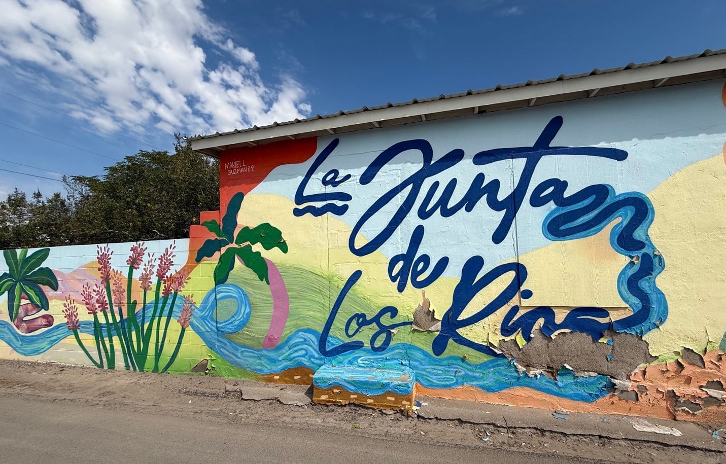 A wall painted with blue text
AI-generated content may be incorrect.