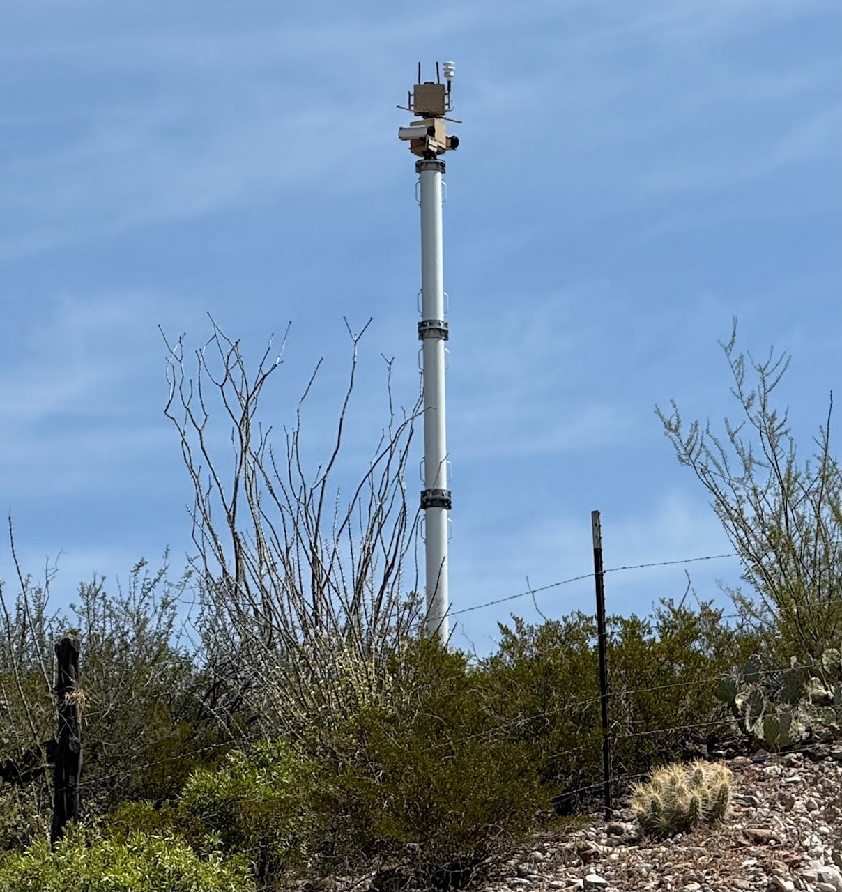 A tall metal tower with a blue sky
AI-generated content may be incorrect.